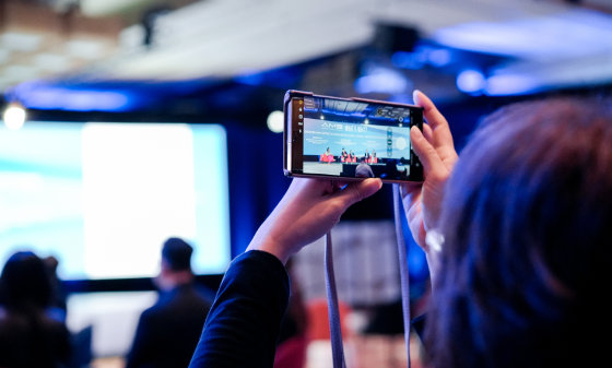 smartphone used to capture and livestream a conference presentation