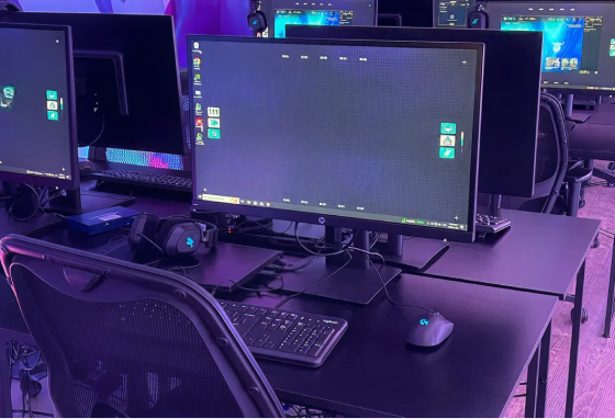 High-performance gaming setup with monitors, keyboard, and headset
